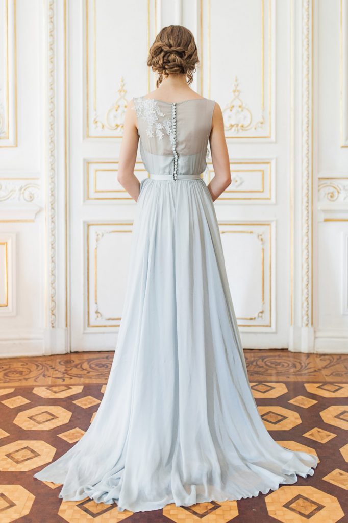 Blue grey wedding gown with floral lace appliques floating down the ...