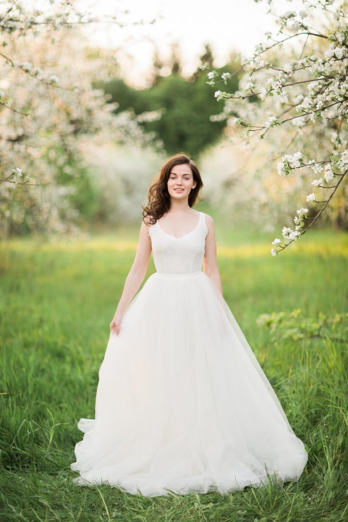 Off-white v-neck wedding dress with sleeveless lace bodice | Cathy Telle