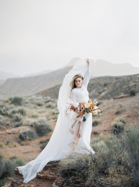 Off-white cape wedding gown with hand-cut silk petals and crystal ...